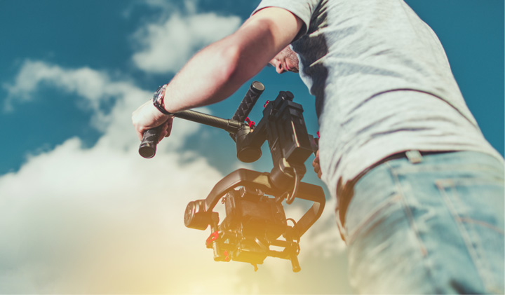 cameraman filming with stabilizer